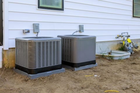 Air-conditioning-system-unit-installed-outside-facade-of-the-new-house Professional HVAC Installation Service In Citrus Heights, CA