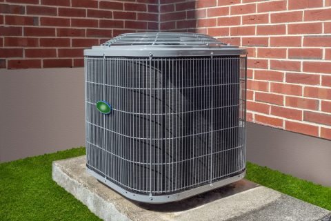 High-efficiency-modern-AC-heater-unit-energy-save-solution-horizontal-outside-an-apartment-complex High-Efficiency HVAC Units Services In Stone Mountain GA