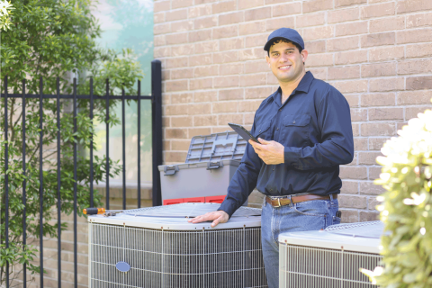 blue-collar-air-conditioner-repairman-working-at-residential-home Expert AC Installation Service In Fort Lauderdale