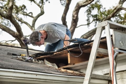 man-checking-roof-leak